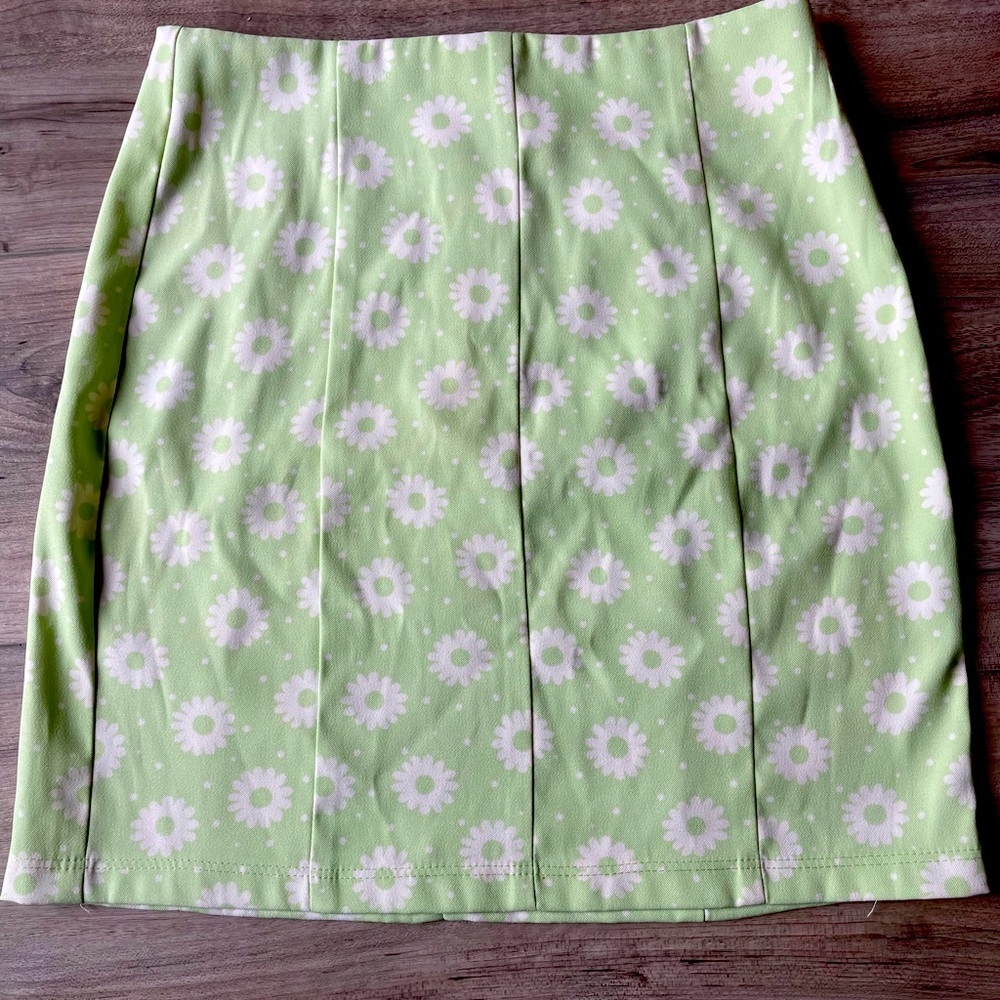 Super cute skirt. Light green with white flowers. Worn only once.